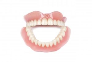 These aren’t your father’s dentures; they may be necessary and, today, they look natural